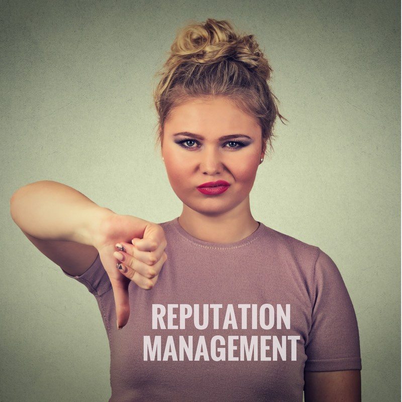 women with one thumb down with a reputation management tshirt on