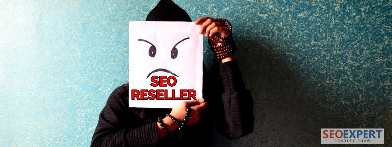 a digital marketing person hiding his face with a sign seo reseller